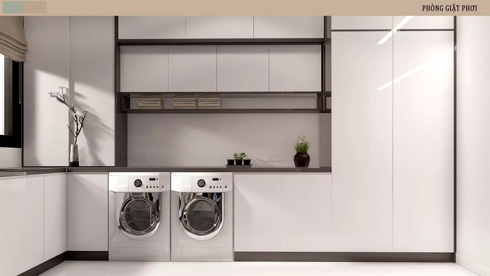 Phòng giặt sấy hiện đại với hệ thống máy giặt, sấy và tủ đựng đồ gọn gàng. 